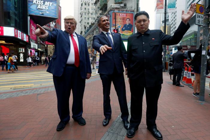 Impersonators of North Korean leader Kim Jong-un, former U.S. President Barack Obama, and U.S. President Donald Trump pose in Hong Kong