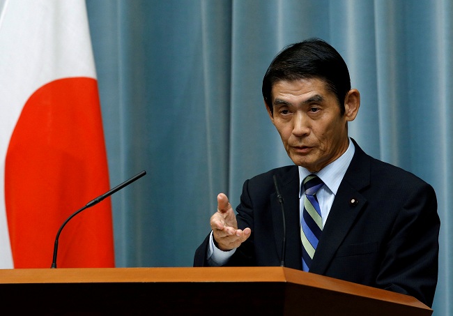 FILE PHOTO: Japan's State Minister in charge of Reconstruction Masahiro Imamura speaks at a news conference in Tokyo