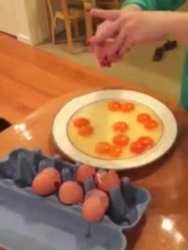 Woman-cracks-a-dozen-eggs-and-is-stunned-to-find-two-yolks-inside-every-shell