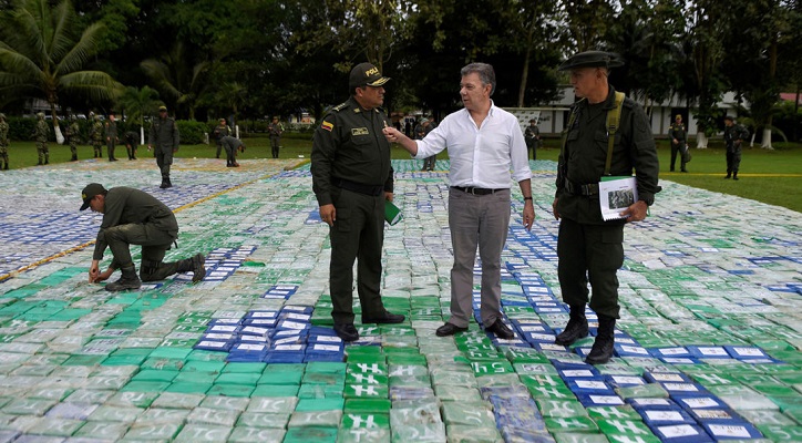 Colombia's President Juan Manuel Santos looks on after the seizure of more than 12 tons of cocaine in Apartado, Colombia